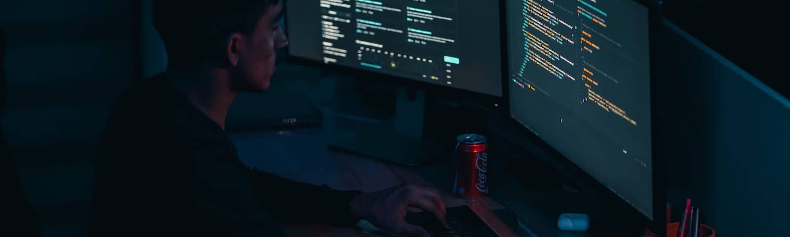 man in black long sleeve shirt using computer